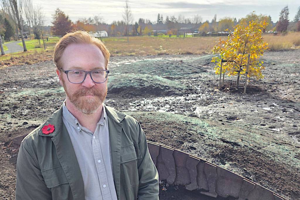 Niall McGarvey, Township Assistant Manager of Parks, Design, and Development explained how an oak tree from Vimy Ridge survived to be replanted in time for Remembrance Day, with landscaping that resembles the torn-up terrain of the battleground. (Dan Ferguson/Langley Advance Times)